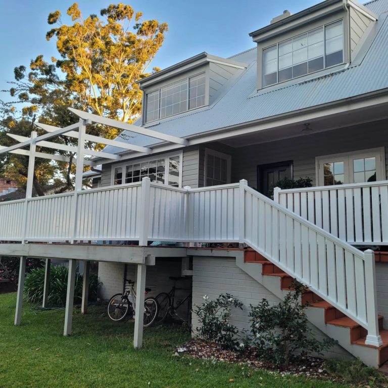 a house with a deck and stairs