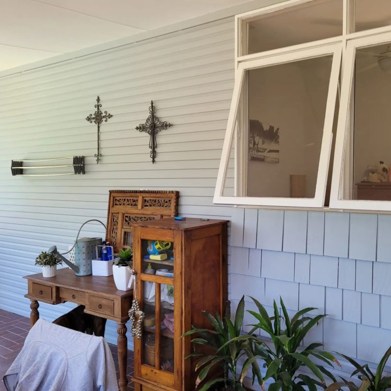 a desk and a cabinet on a porch