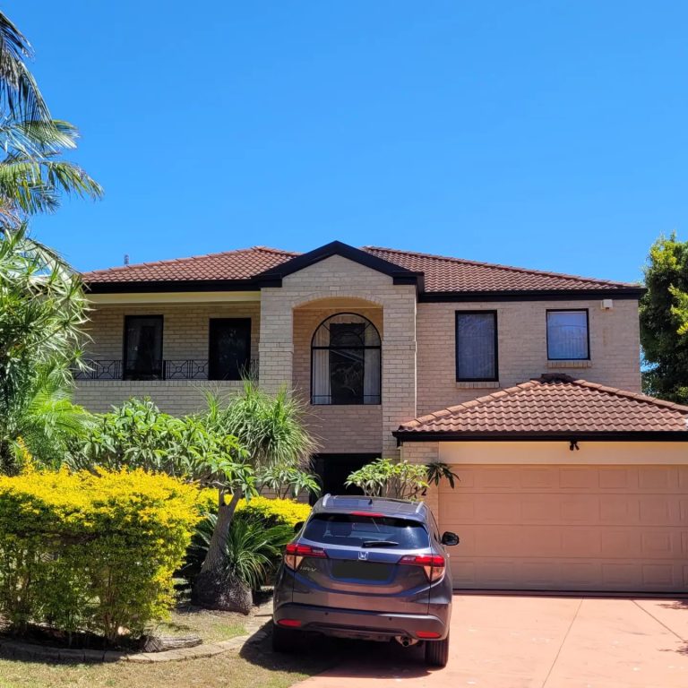 a house with a car parked in front of it